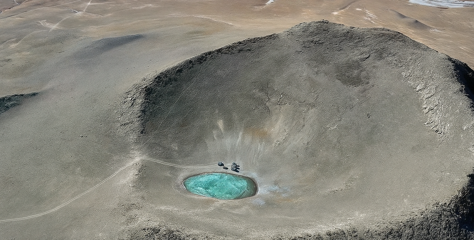 High-altitude desert landscape of Ba Mao Qiong Zong on the Tibetan Plateau with small turquoise lake