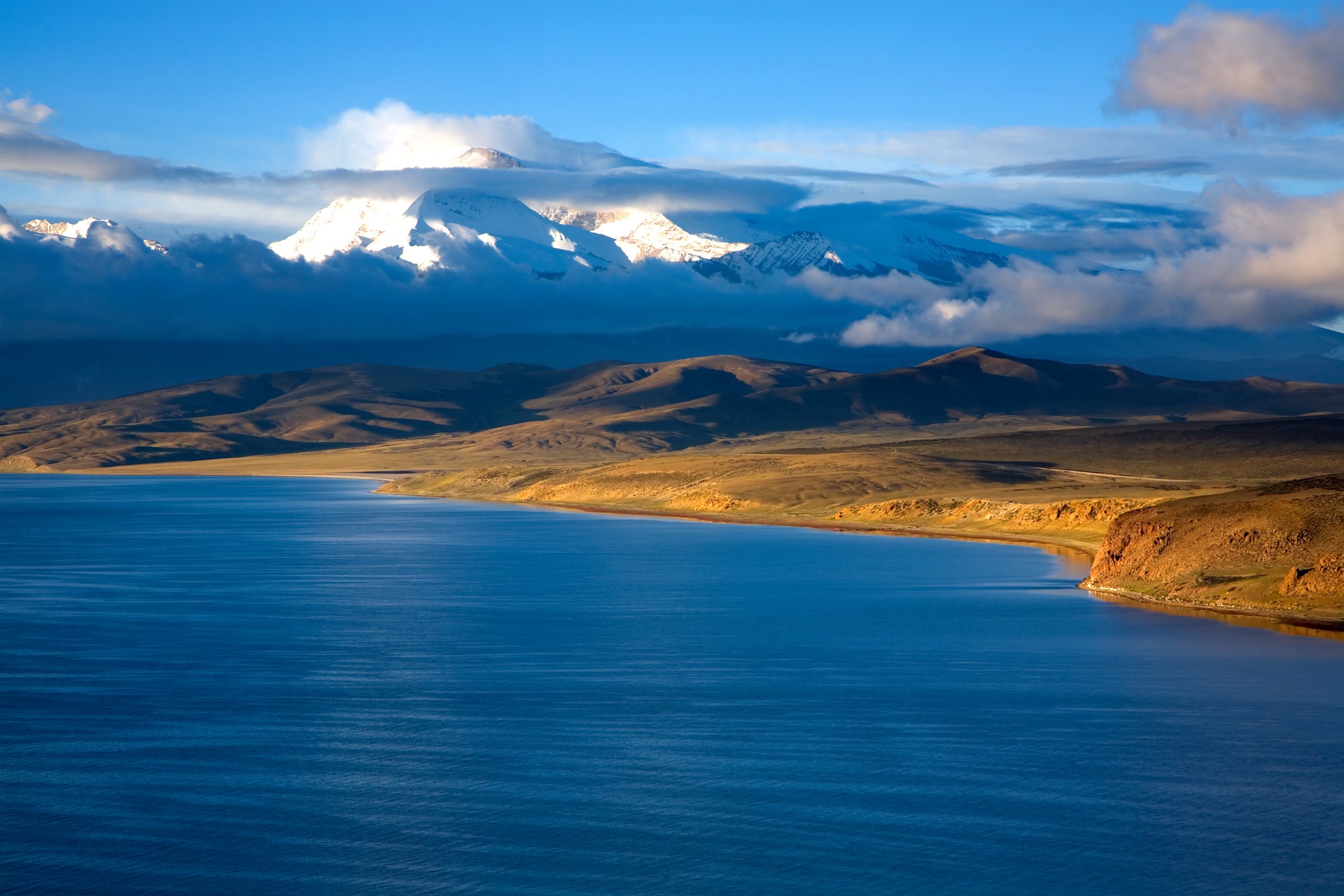 Lake Manasarovar reflecting surrounding mountains in Tibet