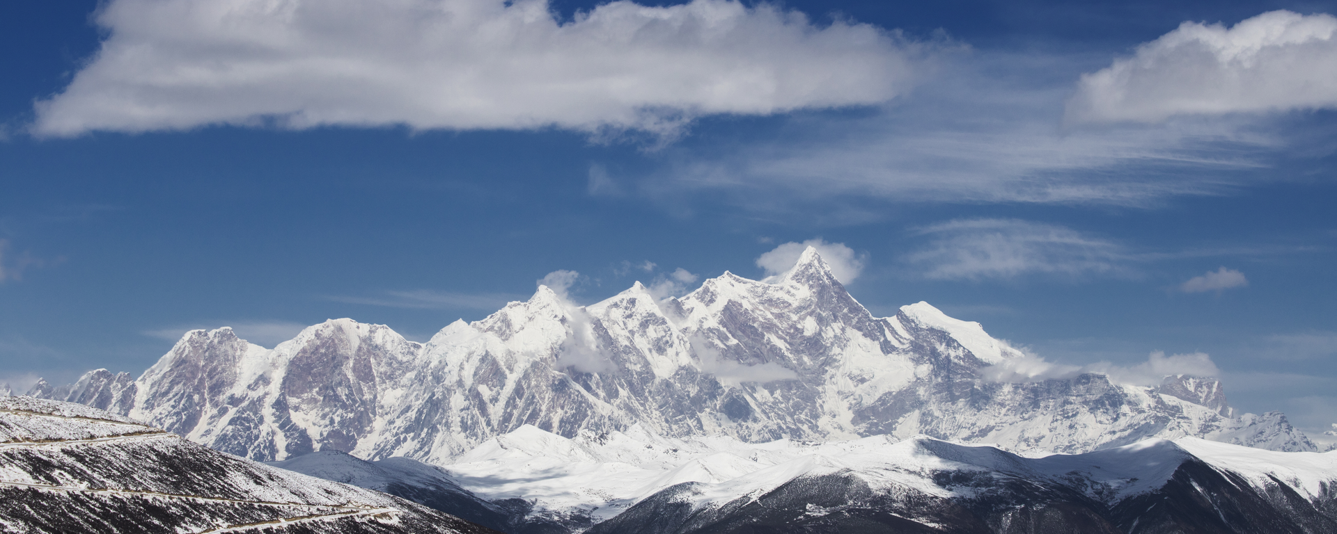 Mount Namcha Barwa summit partially veiled in clouds in southeastern Tibet
