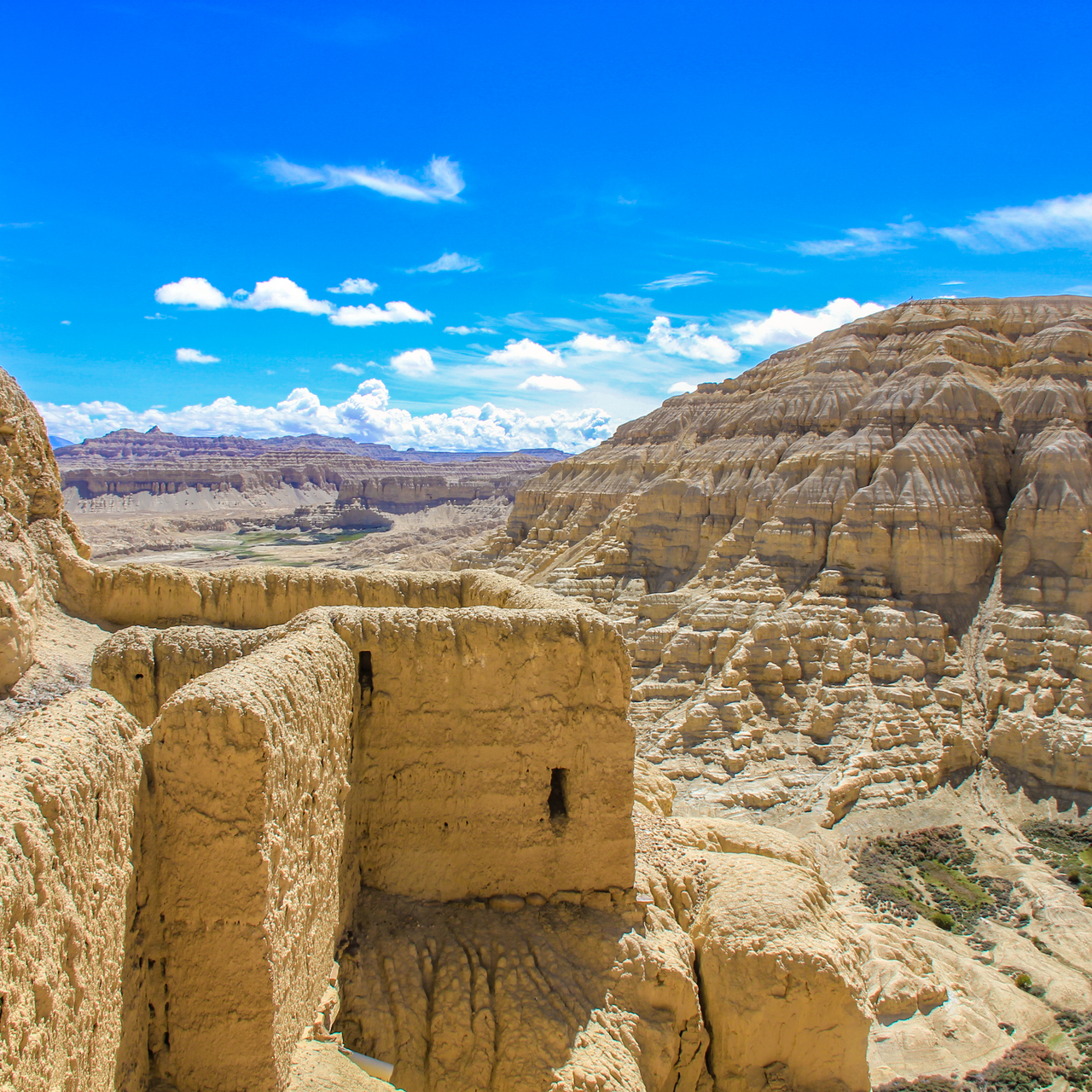 Ruins of the Guge Kingdom overlooking clay rock formations on the Tibetan Plateau