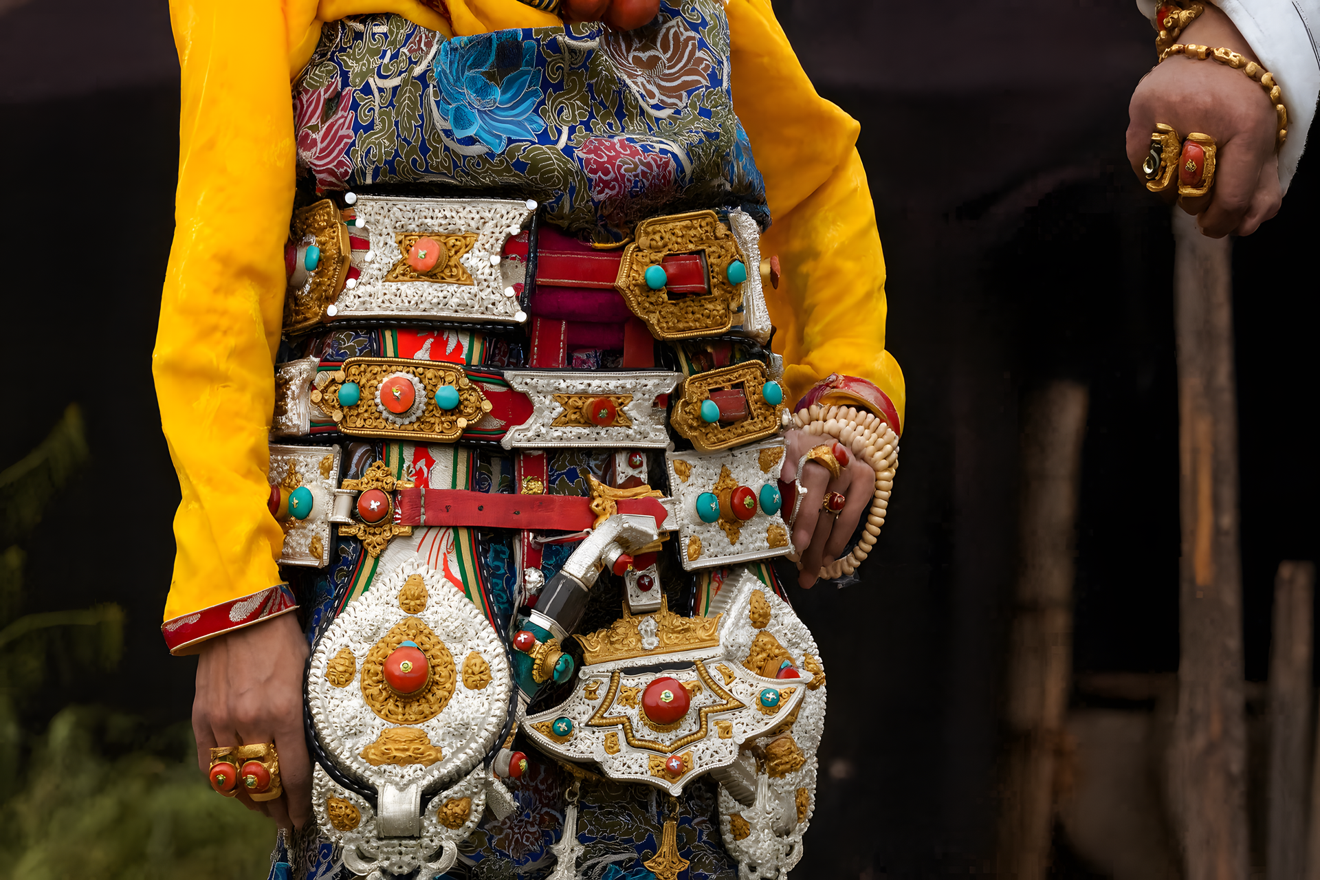 Traditional Tibetan costume with turquoise and coral inlaid silver belt ornaments