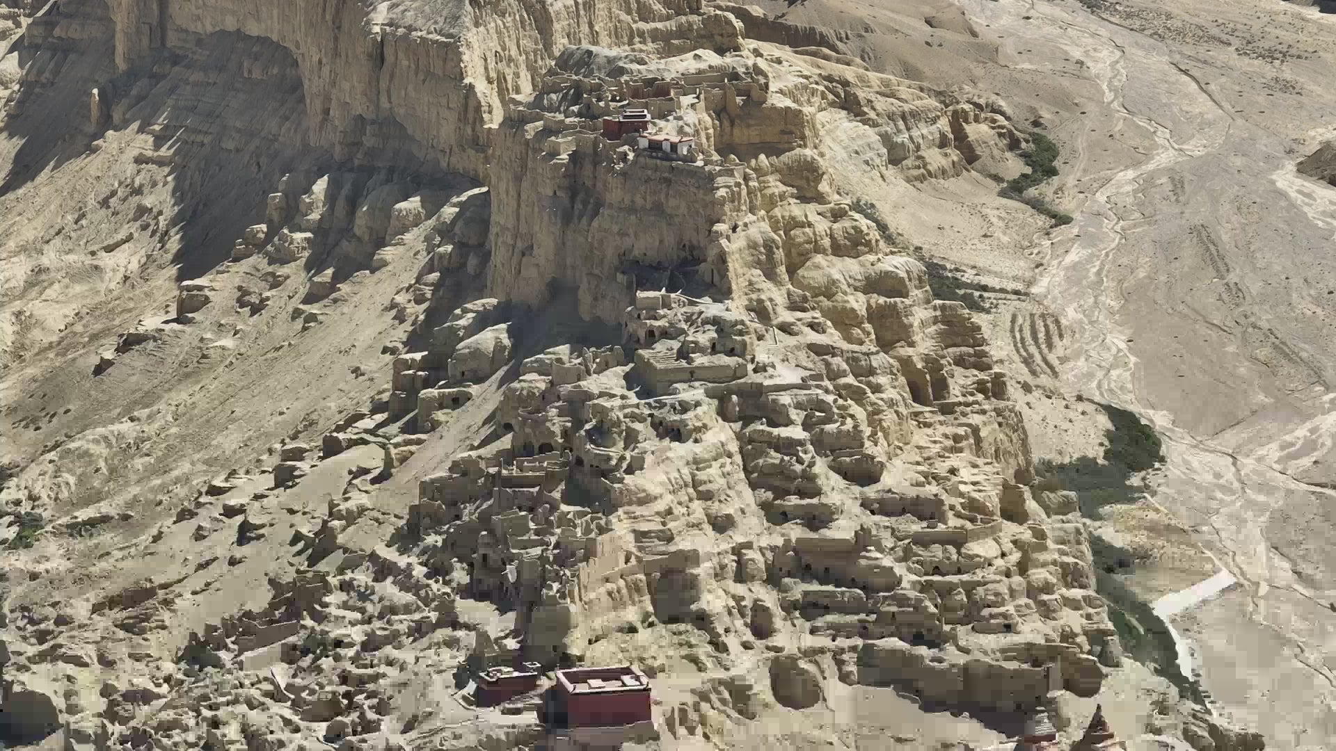 Ancient Guge Kingdom ruins carved into desert cliffs in western Tibet, dramatic earthen fortress